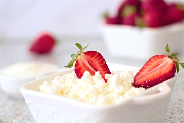 Tasty food. A dish of fresh strawberries and cottage cheese. Vitamin supplement. Dietary and vegetarian product. Add healthy and nutritious food to your diet.