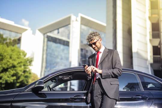 Handsome Businessman Checking His Phone