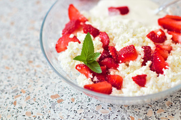 Tasty food. A dish of fresh strawberries and cottage cheese. Vitamin supplement. Dietary and vegetarian product. Add healthy and nutritious food to your diet.