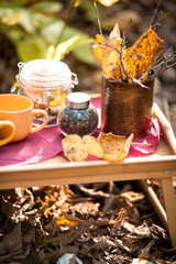 still life with tea, coffee beans, yellow and brown leaves, autumn mood, selective focus