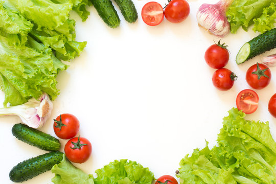 Healthy Fresh Vegetables For Salad. Raw Green Lettuce, Greens, Tomato Over White Countertop. Top View. Copy Space. Clean Eating, Vegan. Food Concept.