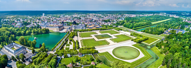 Aerial view of Chateau de Fontainebleau with its gardens, a UNESCO World Heritage Site in France © Leonid Andronov