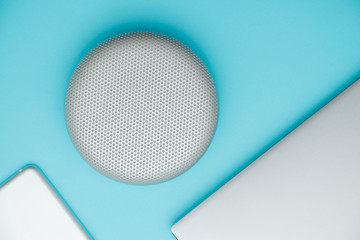 Isolated aqua flat lay creative design portable wireless bluetooth speaker for music listening