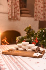 Fototapeta na wymiar Cheese handmade near the stove new year decoration gift table feast by the stove