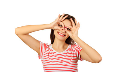 Cheerful girl holding fingers near eyes like glasses. emotional girl isolated on white background