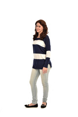  full length portrait of girl wearing striped blue and white jumper and jeans. standing pose on white studio background