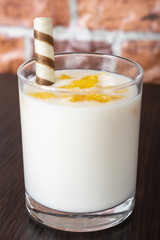 fruit cocktails made of yogurt, Healthy morning drink on the background of old wood and bricks