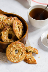 Homemade peanut cookies in a wooden bowl. Tea time in a rustic style.