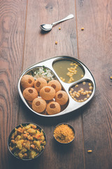 Pani Puri OR Golgappa is a popular Indian Chat menu, selective focus