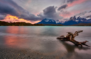 View of the mountain of Cuernos del Paine in the national park of Torres del Paine during a bright sunset. Chilean Patagonia in Autumn.
