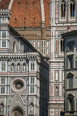 Fototapeta premium Close-up of the dome of the Santa Maria del Fiore Cathedral and Giotto's Campanile (bell tower). In the town of Florence, the famous and amazing capital of the Italian Renaissance. Tuscany region