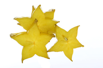 heap of slices of yellow starfruit (carambola) isolated