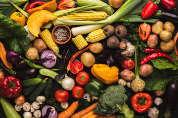 Heap of fresh vegetables on wooden background with copy space