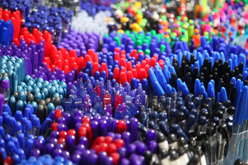 Obraz premium Automatic ballpoint pen. School supplies, stationery accessories. Colorful stationery. Stationery store. Goods for office and study.