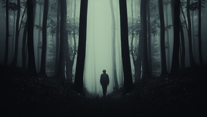 man on dark scary forest road, surreal landscape