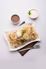 Egg Biryani - Basmati rice cooked with masala roasted eggs and spices and served with yogurt,...