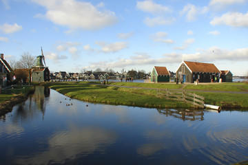Obraz premium traditional Dutch countryside with windmills and canals; Zaanse Schans, Netherlands