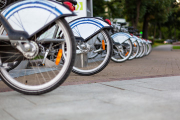 Bicycle rental station on city street.