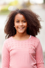 Cute African American girl in the street with afro hair