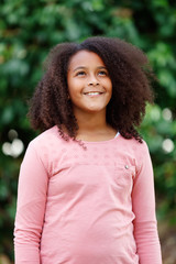 Cute African American girl in the street with afro hair