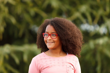 Cute African American girl in the street with afro hair