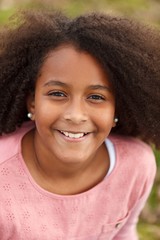 Cute African American girl in the street with afro hair