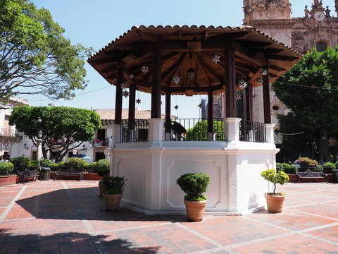 Historical white well at main square in Taxco city center in Mexico