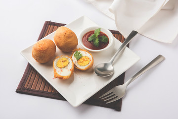 Tasty Egg Pakora or Pakoda served with tomato ketchup