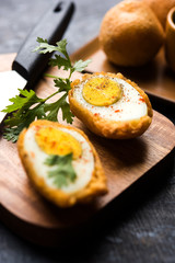 Tasty Egg Pakora or Pakoda served with tomato ketchup