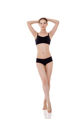 Fototapeta na wymiar woman with perfect sporty body in black lingerie