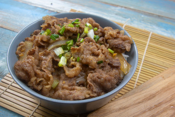 Cooked beef with rice on bowl