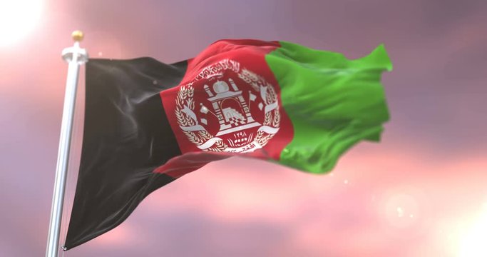 Afghanistan flag waving at wind in slow at sunset, loop