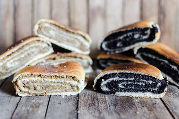 rustic poppy seeds strudel slices on wooden table