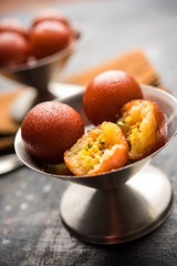 Sweet Gulab Jamun in terracotta bowl