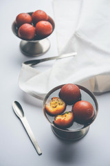Sweet Gulab Jamun in terracotta bowl