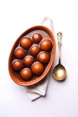 Sweet Gulab Jamun in terracotta bowl