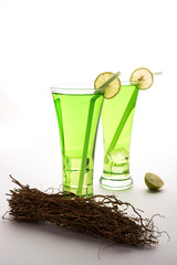 Khus Sharbat or Vetiver Drink served in a glass with Mint and Lemon slice, selective focus