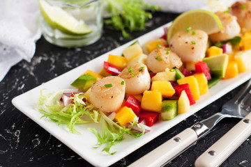 Seared scallops with mango and pineapple salsa