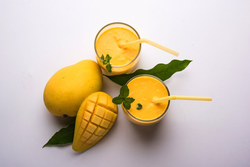 Mango Lassi, Indian popular summer drink in a terracotta glass, selective focus