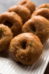 Balushahi sweet food served in a white or golden plate over moody background