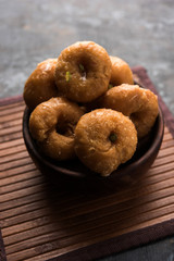 Balushahi sweet food served in a white or golden plate over moody background