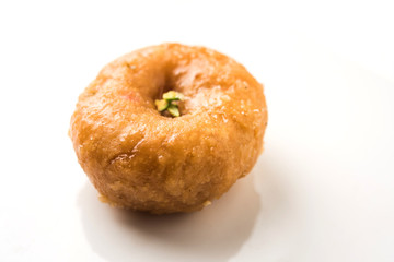 Balushahi sweet food served in a white or golden plate over moody background