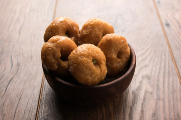 Balushahi sweet food served in a white or golden plate over moody background