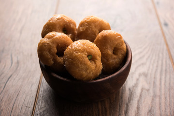 Balushahi sweet food served in a white or golden plate over moody background