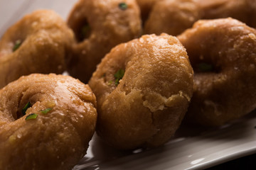 Balushahi sweet food served in a white or golden plate over moody background