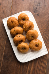 Balushahi sweet food served in a white or golden plate over moody background