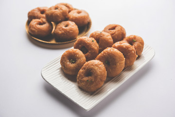 Balushahi sweet food served in a white or golden plate over moody background