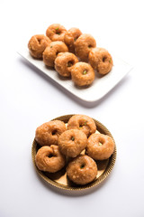 Balushahi sweet food served in a white or golden plate over moody background