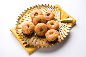 Balushahi sweet food served in a white or golden plate over moody background