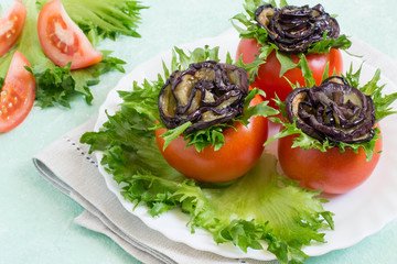 Tomatoes stuffed with cheese with eggplants in form of rose